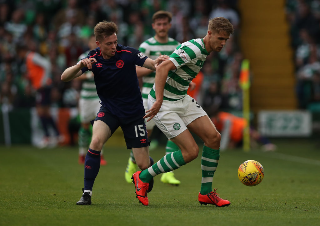 GLASGOW, SCOTLAND - MAY 19: Craig Wighton of Hearts vies with Kris Ajer of Celtic during the Scottish Premier league match between Celtic and Hearts at Celtic Park on May 19, 2019 in Glasgow, Scotland.