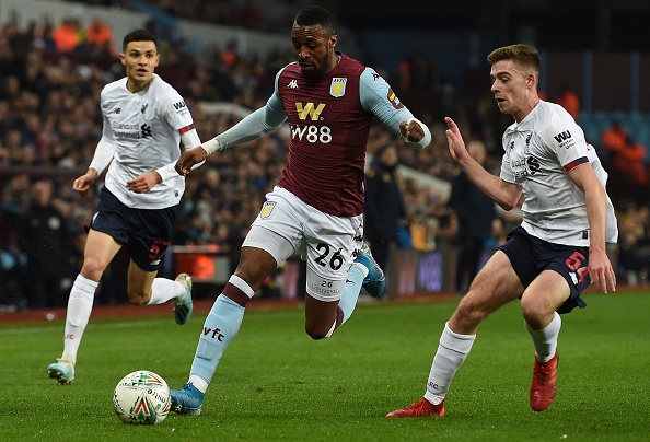 Aston Villa's Ivorian striker Jonathan Kodjia (C) vies with Liverpool English midfielder Isaac Christie-Davies (L) and Liverpool's Scottish defender Tony Gallacher during the English League Cup quarter-final football match between Aston Villa and Liverpool at Villa Park in Birmingham, central England, on December 17, 2019. (Photo by Paul ELLIS / AFP) / RESTRICTED TO EDITORIAL USE. No use with unauthorized audio, video, data, fixture lists, club/league logos or 'live' services. Online in-match use limited to 120 images. An additional 40 images may be used in extra time. No video emulation. Social media in-match use limited to 120 images. An additional 40 images may be used in extra time. No use in betting publications, games or single club/league/player publications. /