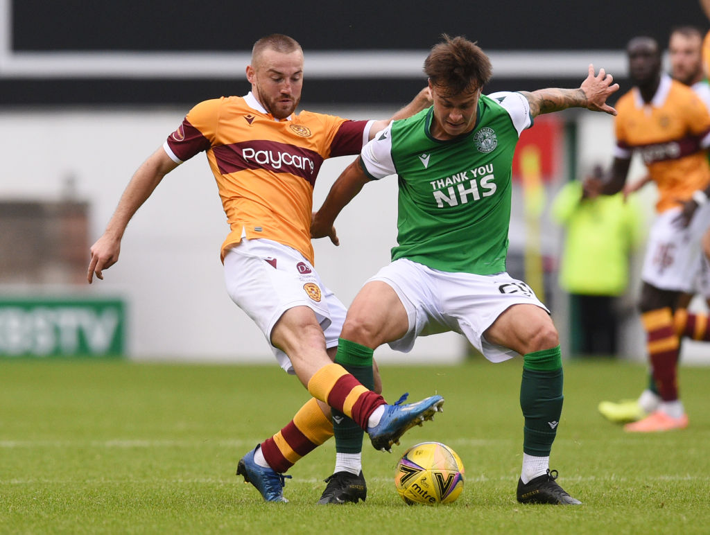 EDINBURGH, SCOTLAND - AUGUST 15: Motherwell's Allan Campbell (left) tackles Hibernian's Melker Hallberg during the Scottish Premiership match betwe...