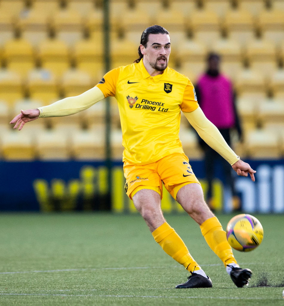 Ciaron Brown clears the ball for Livingston