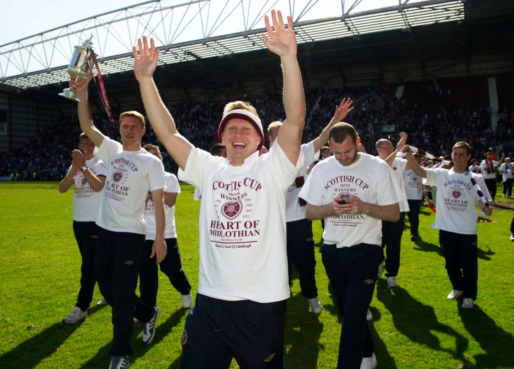 Hearts players celebrate at Tynecastle after winning the Scottish Cup in 2012