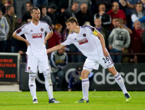 23/08/12 UEFA EUROPA LEAGUE PLAY-OFF 1ST LEG.HEARTS v LIVERPOOL.TYNECASTLE - EDINBURGH.Hearts captain Marius Zaliukas (right) gives encouragement to team-mate Andy Webster after his own goal