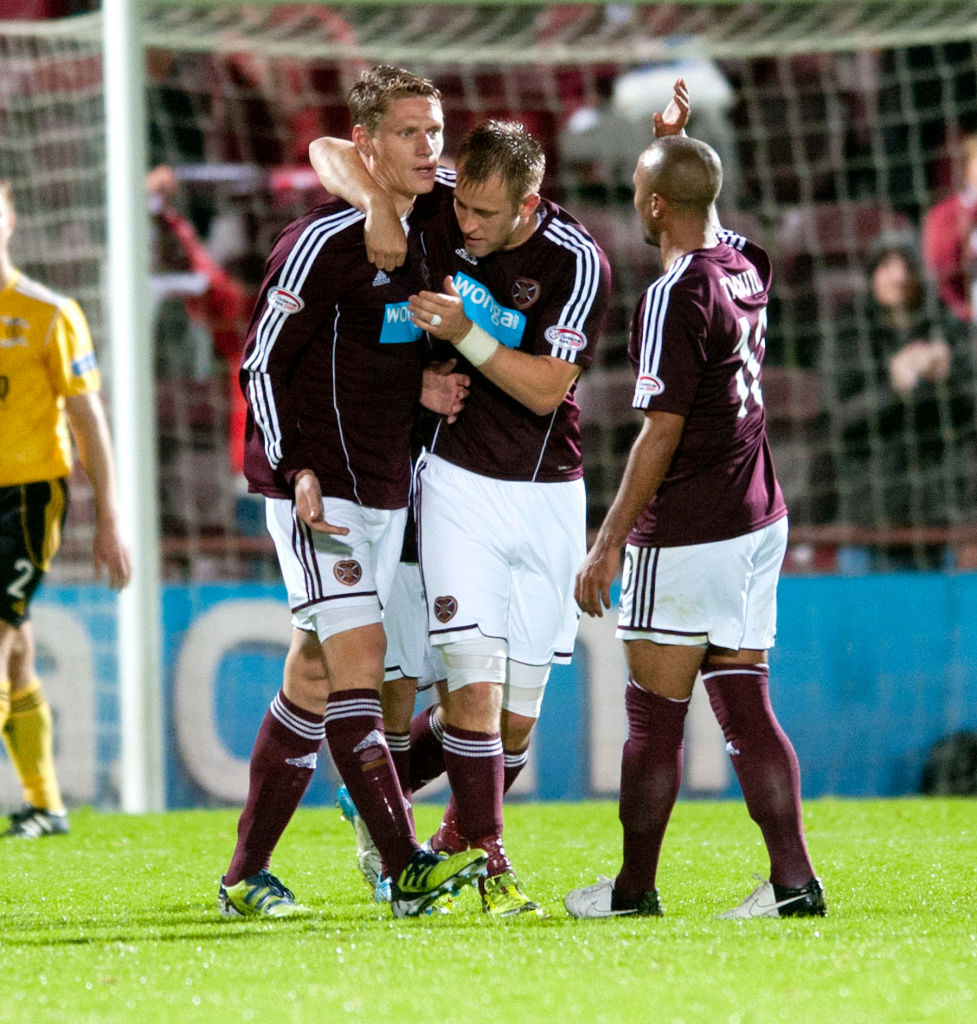 25/09/12 SCOTTISH COMMUNITIES LEAGUE CUP 3RD RND.HEARTS v LIVINGSTON (3-1).TYNECASTLE - EDINBURGH.Hearts' Marius Zaliukas (left) is hailed by fellow scorer Danny Grainger after putting the home side back in front